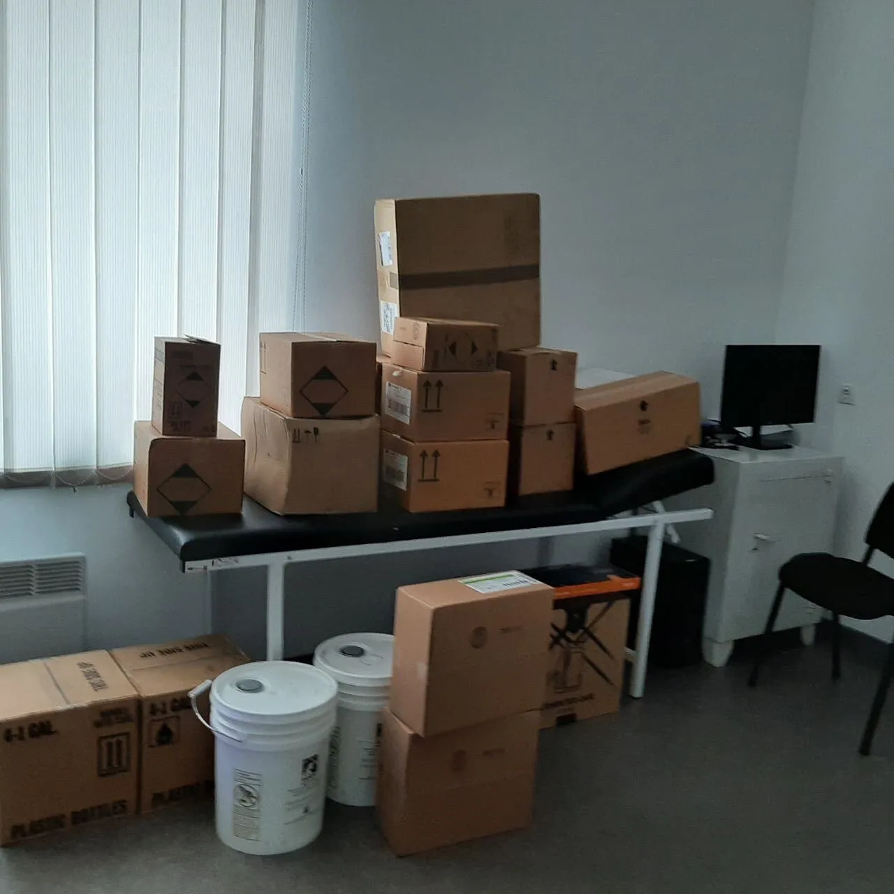 a room filled with lots of boxes and boxes on top of a table.