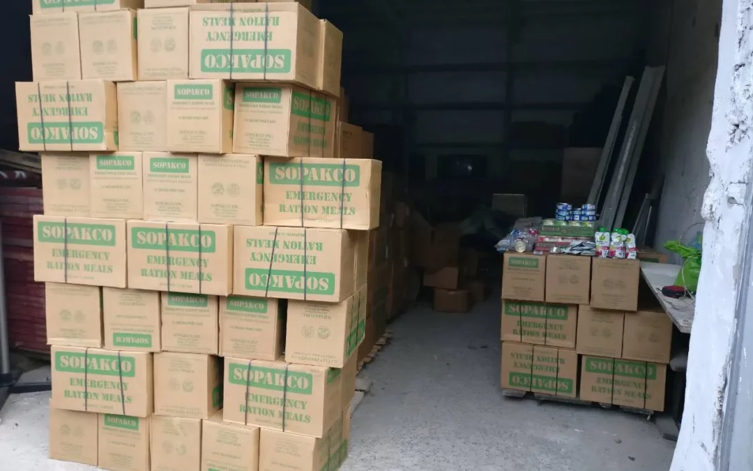 a bunch of boxes stacked up in a garage.