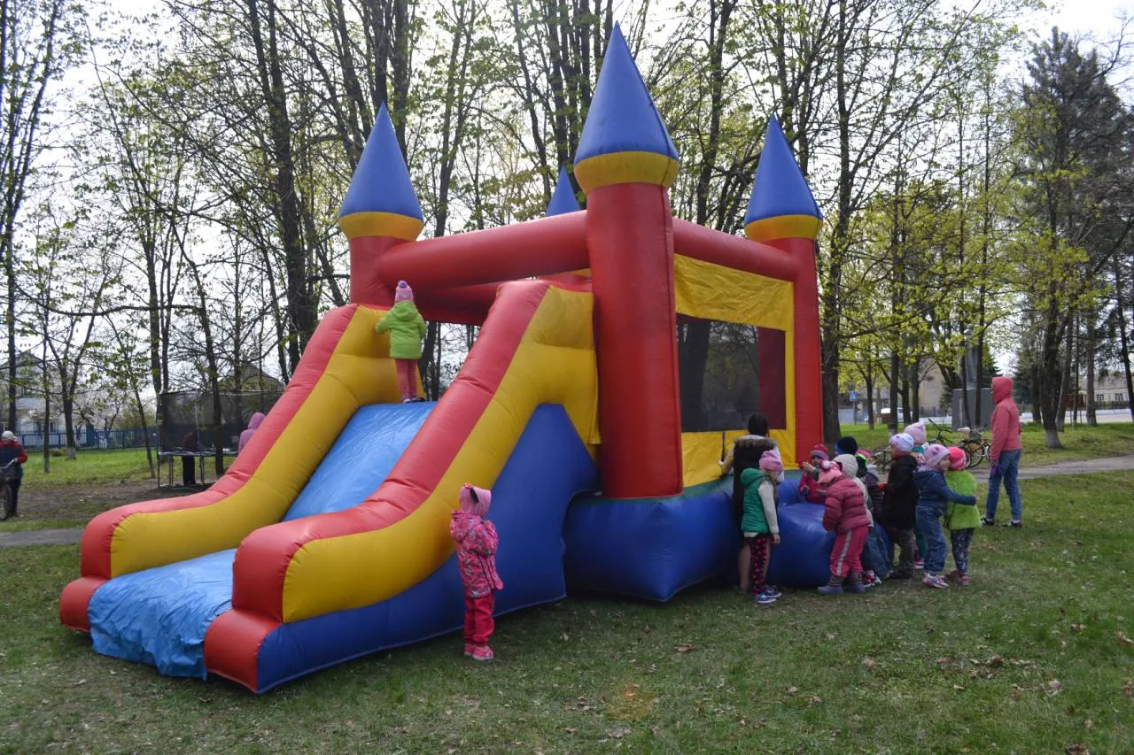 a large inflatable bounce house with a slide.