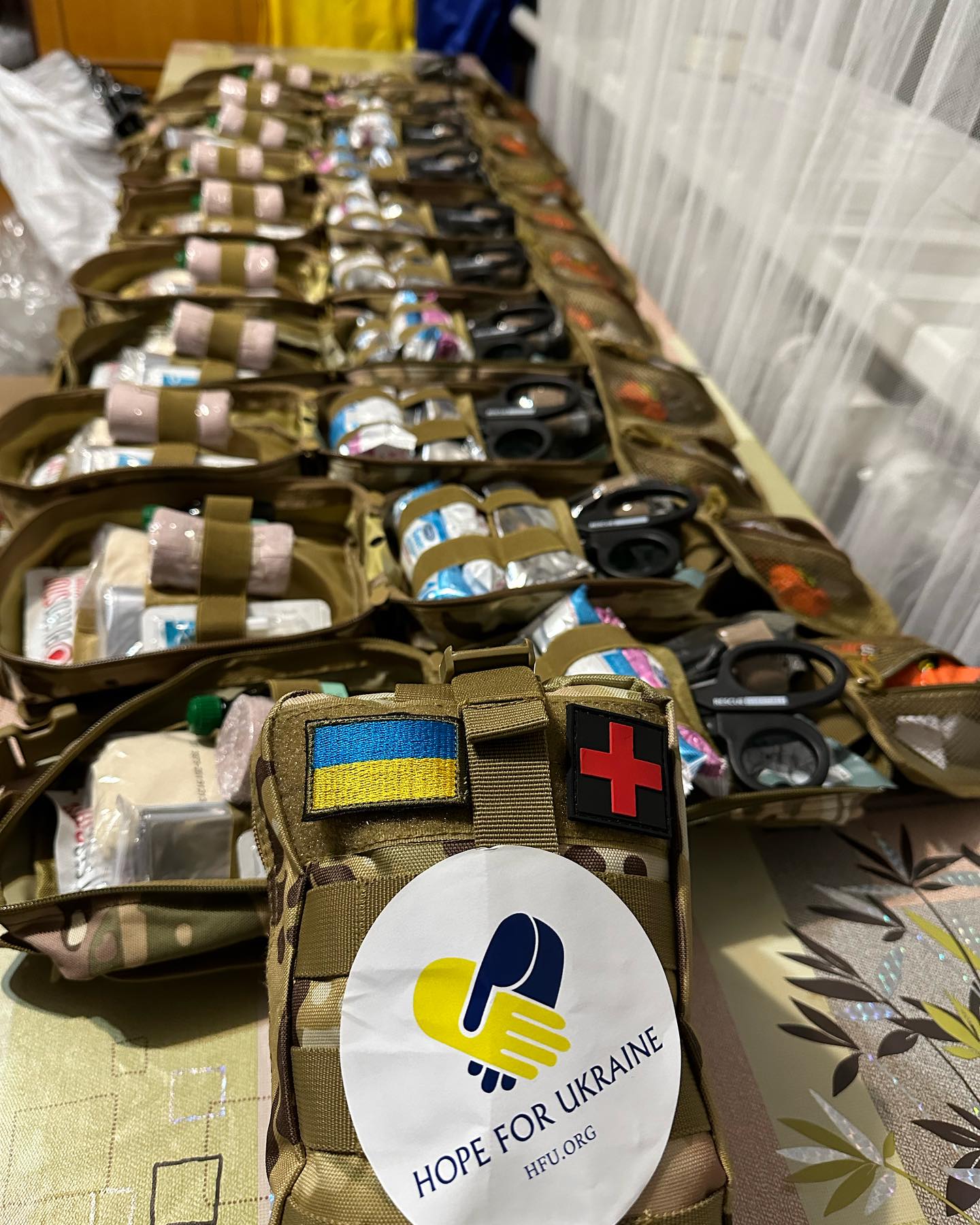A table full of bags of medical supplies for ukraine.