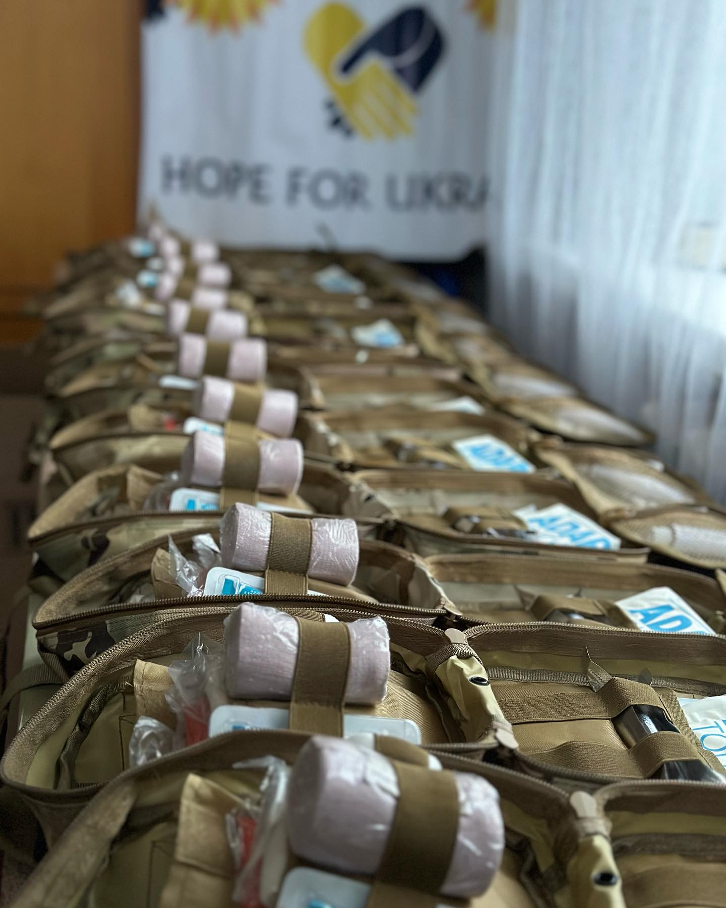 A line of bags with the word hope for ukraine written on them.
