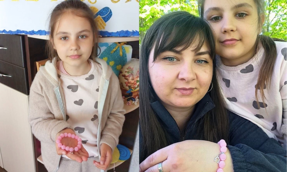 A young girl holds a pink beaded bracelet in a classroom; in a second photo, she poses outdoors with a woman, both wearing matching pink beaded bracelets.