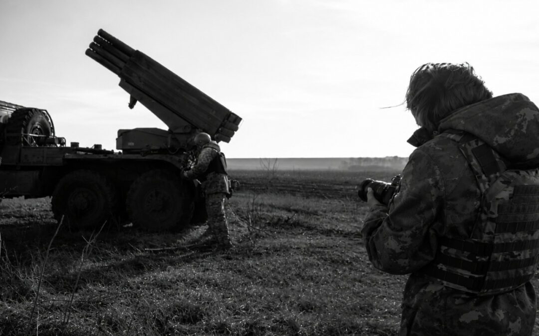Two Ukrainian soldiers in military gear stand near a large rocket artillery vehicle in an open field, one holding a weapon, as food kits in Ukraine are distributed to those in need, all depicted in black and white.