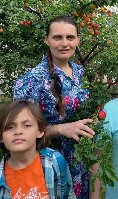 A displaced Ukrainian mother and her children receiving support through Hope For Ukraine