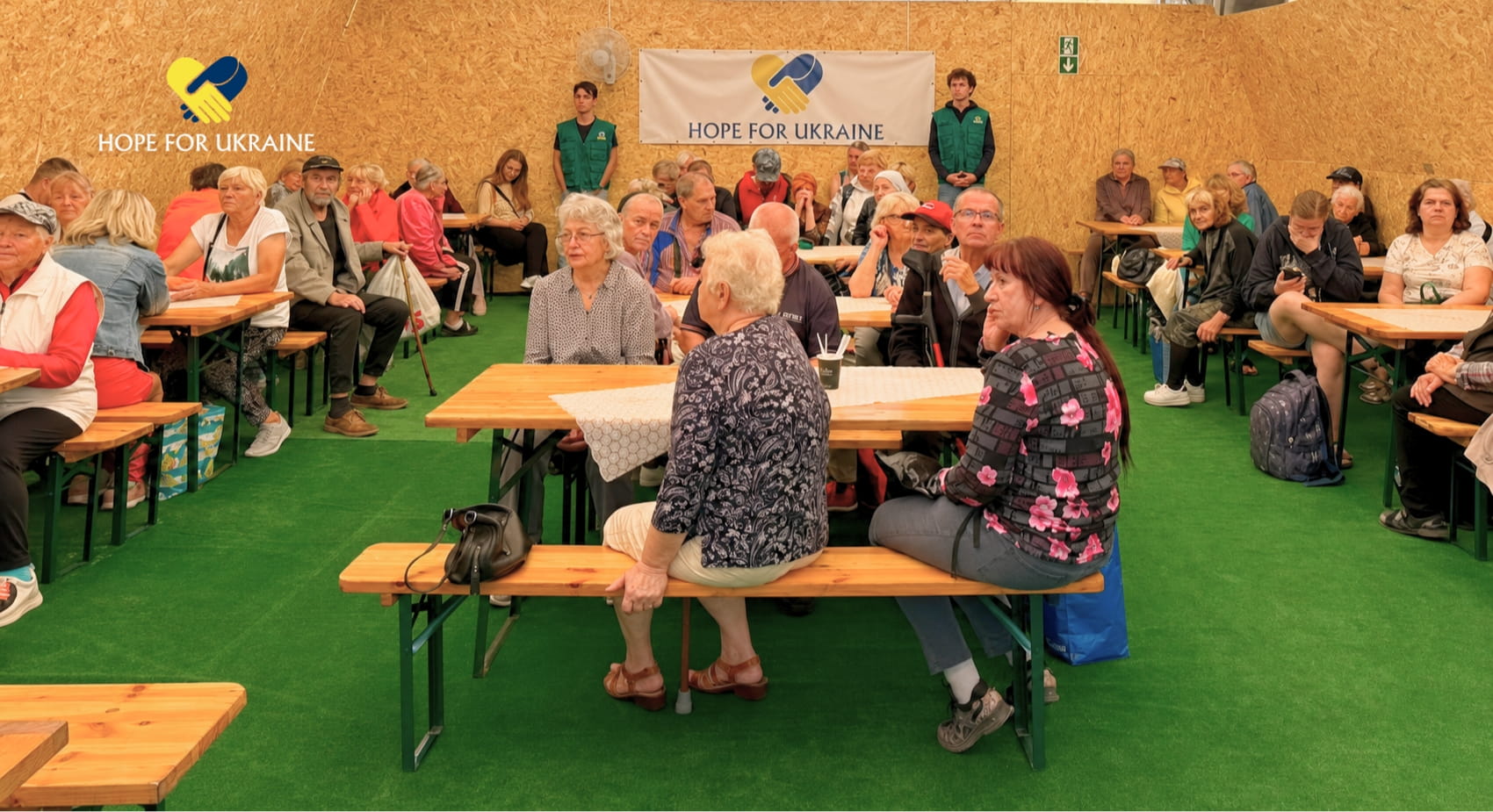 Volunteers serving hot meals to vulnerable seniors at a new soup kitchen in Lviv, Ukraine