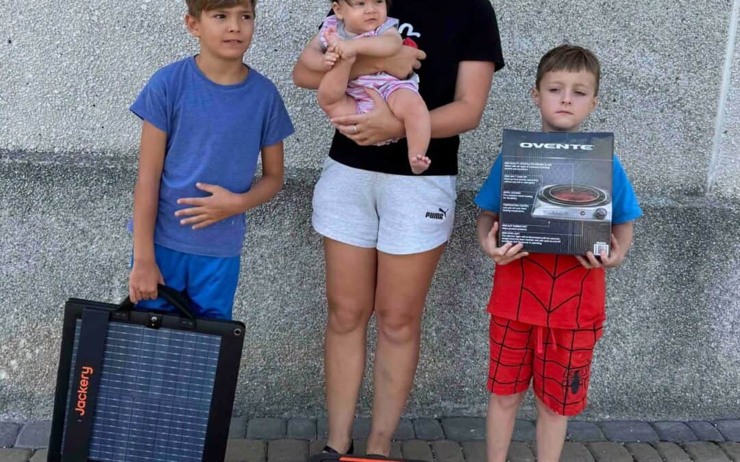 Family with solar panel and emergency power generator in Ukraine.